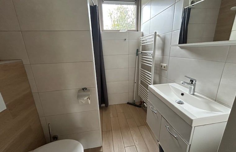 Modern bathroom in Holiday Home in Stramproy, Central Limburg, with sleek decor and natural light for a relaxing stay.