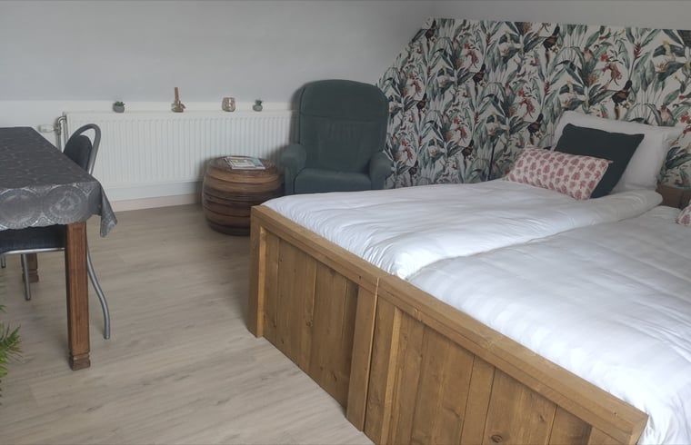 Gemuetliches Schlafzimmer im Ferienhaus in Kelpen-Oler, Mittellimburg, mit bequemen Betten und gemuetlicher Einrichtung fuer einen entspannten Aufenthalt.