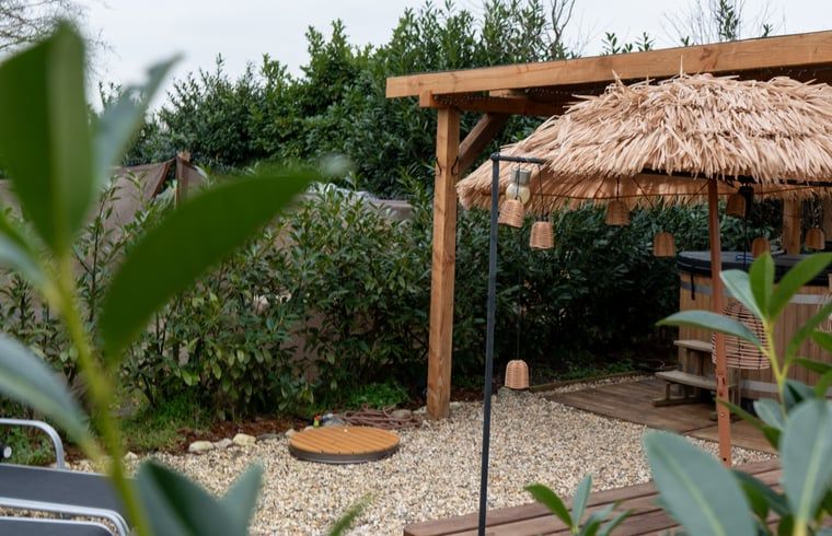 Wooden sauna interior in Holiday home in America, North Limburg, with comfortable seating.