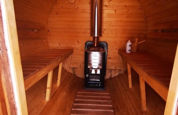 Massage Room in Holiday Home in America, North Limburg, with comfortable massage table and garden view.