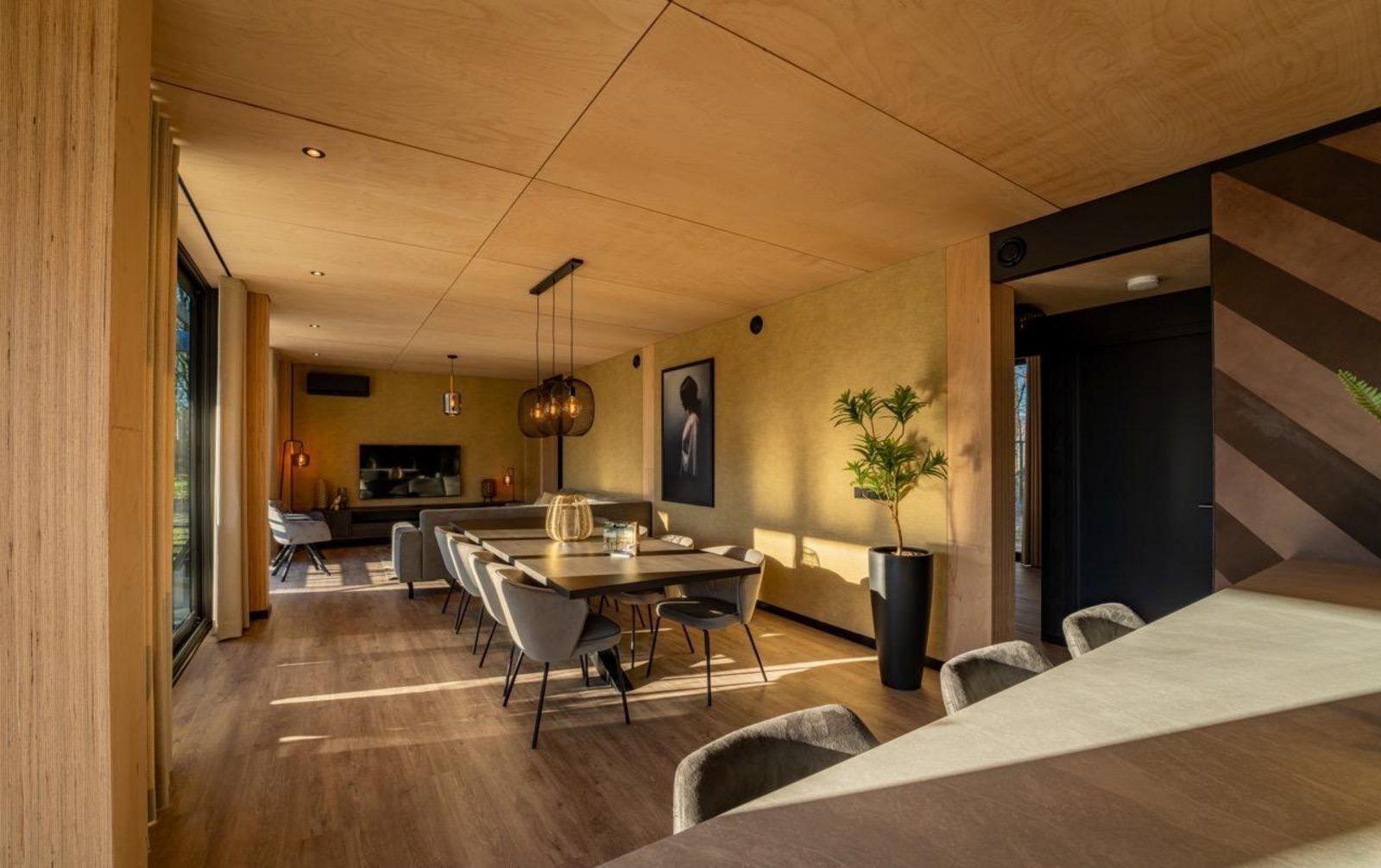 Stylish interior of Bos Villa in Maasbree, North Limburg. Luxury vacation home for 8 with modern furnishings and spacious dining area.