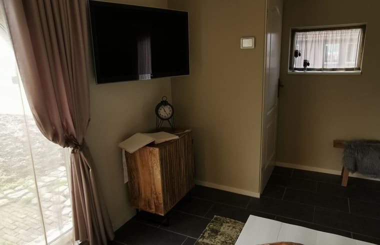 Gemuetliches Wohnzimmer von Huisje in Merselo, modern eingerichtetes Ferienhaus in Nordlimburg.