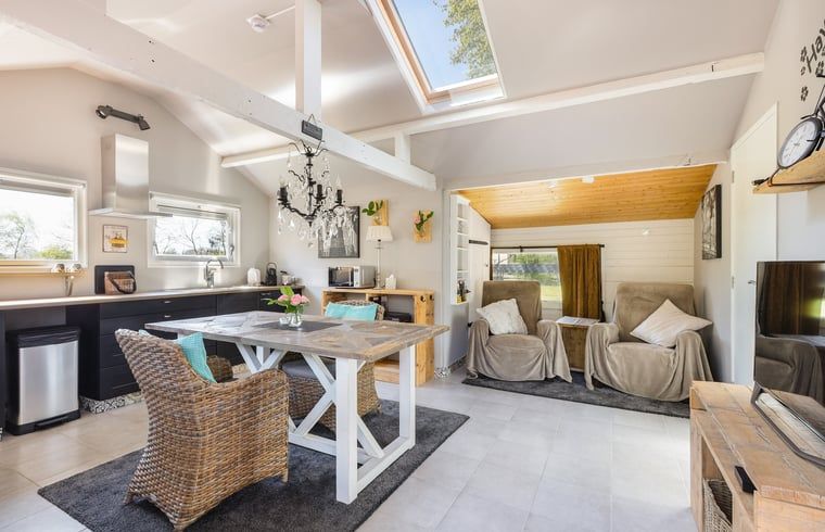 Modern bathroom in Holiday Home in Heythuysen, North Limburg, with sleek white tiles and stylish shower.