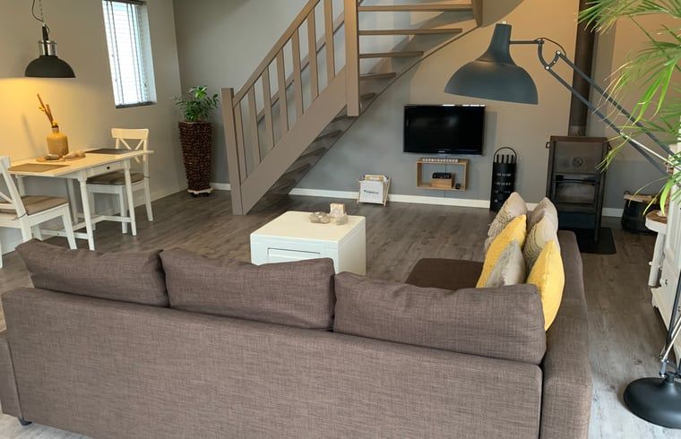 Gezellige woonkamer van Vakantiehuisje in Heythuysen, Noord Limburg, Limburg.
