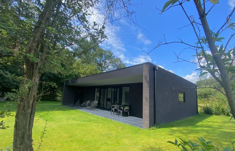 Terrace of Cottage in Wanssum, vacation home in North Limburg with comfortable chairs.