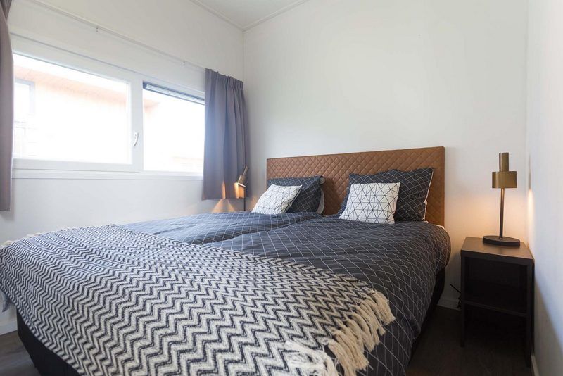 Cozy bedroom with double bed in Module 6 persons vacation home Schin op Geul, South Limburg offers peace and comfort.