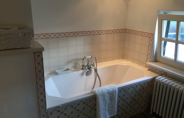 Spacious bathtub in the bathroom of Holiday home in Epen, South Limburg.
