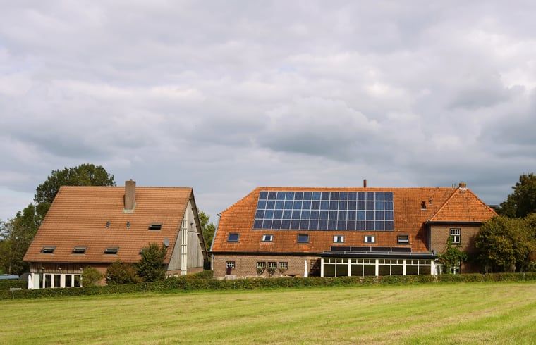 Holiday home in Epen, South Limburg, offers rustic accommodation with solar panels and sweeping views over green fields.