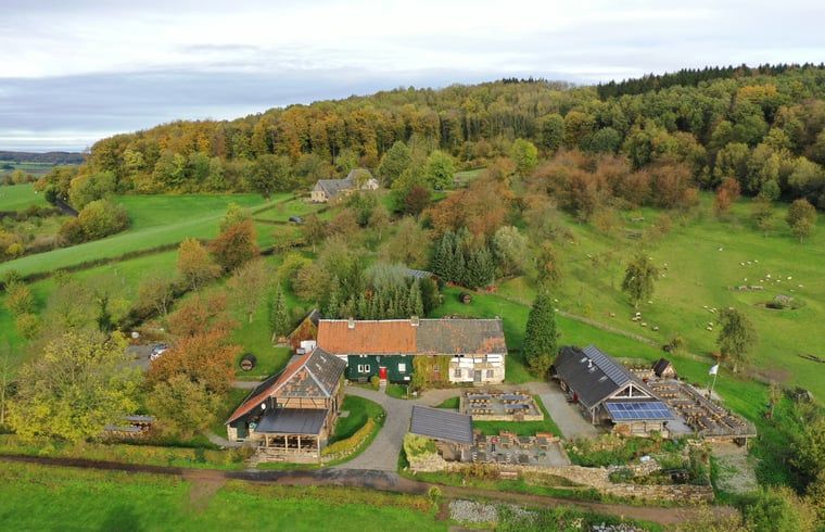 Aerial view of Holiday home in Vijlen, South Limburg, surrounded by green hills and nature, perfect for a relaxing stay.