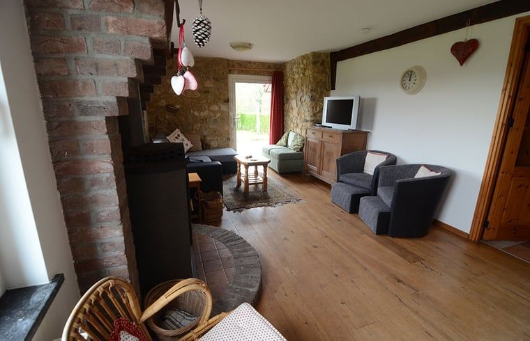 Comfortable sitting area in cottage in Vijlen, South Limburg, perfect for relaxing after a day of exploring.
