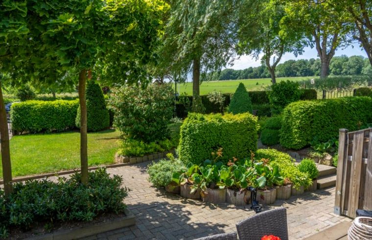 Geniessen Sie den schoenen Garten und die Aussicht ins Gruene im Ferienhaus in Gulpen - Wittem, das im malerischen Suedlimburg liegt.