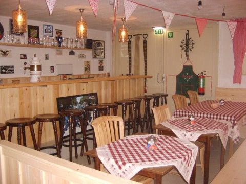 Cozy indoor area of B&B at Kaat in Liessel, De Peel, with a cozy bar and dining area.