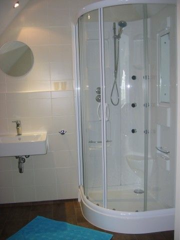 Modern bathroom in B&B at Kaat, Liessel, De Peel, with a luxury shower stall and stylish furnishings.