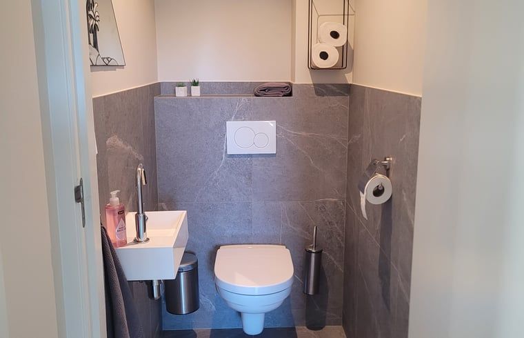 View through to bright dining room from hallway in Cottage in Zeeland, located in De Peel, North Brabant.