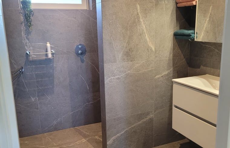 Stairs to upper floor in Huisje in Zeeland, a cozy vacation home in De Peel, North Brabant.