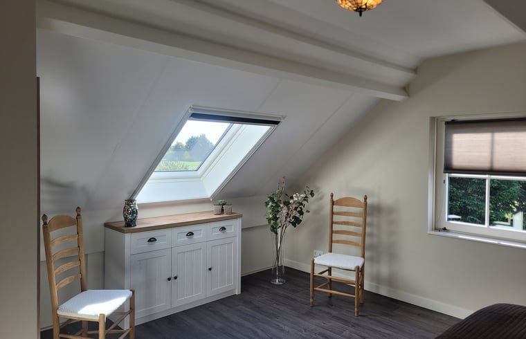 Exterior of Cottage in Zeeland with sunny terrace and green garden in De Peel, North Brabant.