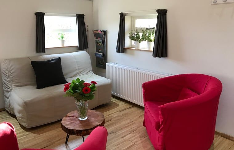 Gemuetliche Sitzecke im Ferienhaus in Baarle Nassau, entspannender Aufenthalt in Kempen, Nordbrabant.