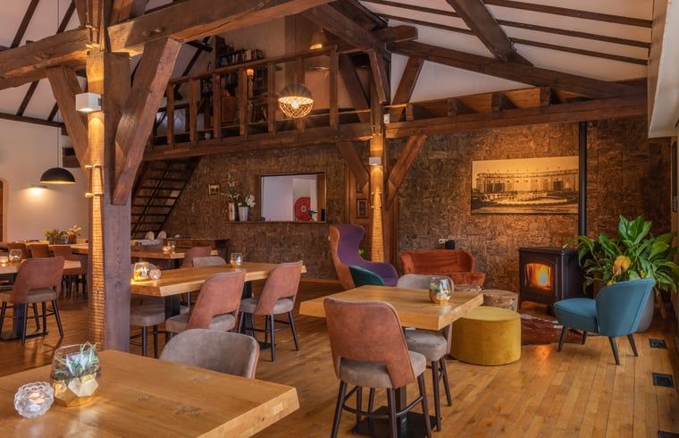 Gemuetliche Sitzecke mit Kamin in Huisje in Baarle-Nassau, Ferienhaus in stimmungsvollem Baarle-Nassau.