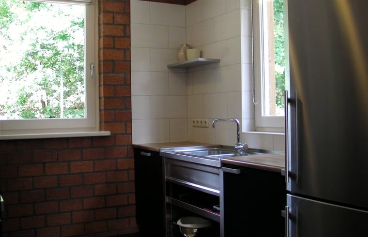 Recreatieruimte in Vakantiehuisje in Luyksgestel met biljart en tafelvoetbal voor entertainment.