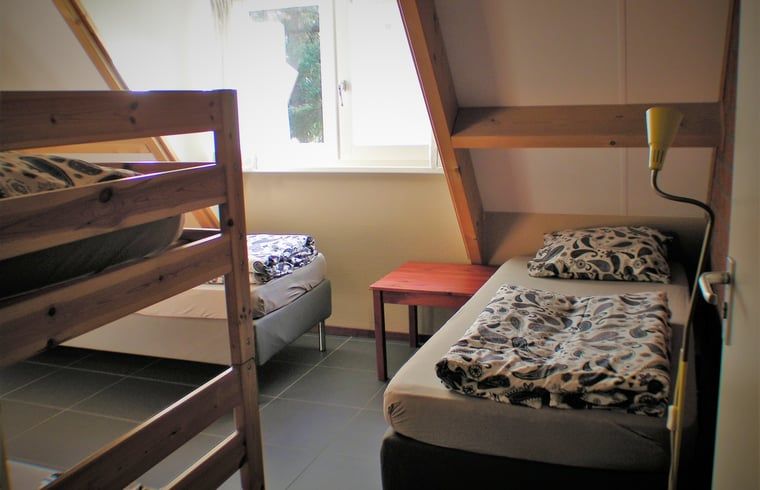 Intieme slaapkamer in Vakantiehuisje in Luyksgestel, perfect voor een rustige nachtrust.