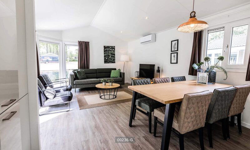 Spacious living room in Ferox 5 persons vacation home in Cromvoirt, Heart of Brabant, North Brabant with comfortable sitting area.