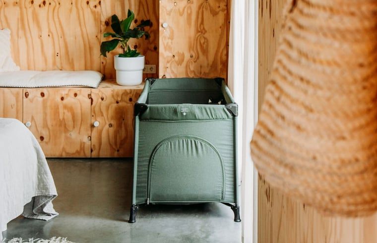 Cozy child-friendly corner with crib in Holiday home in Chaam, Heart of Brabant, North Brabant.