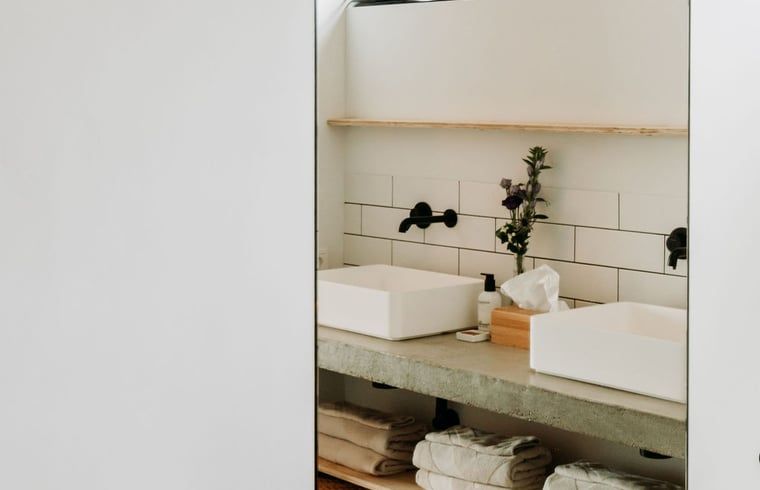 Modern bathroom with double sink in Holiday home in Chaam, North Brabant, stylish and spacious.