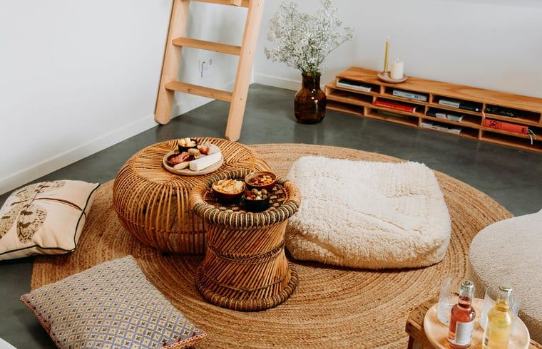 Cozy sitting area with floor cushions in Holiday home in Chaam, North Brabant, perfect place for relaxation.