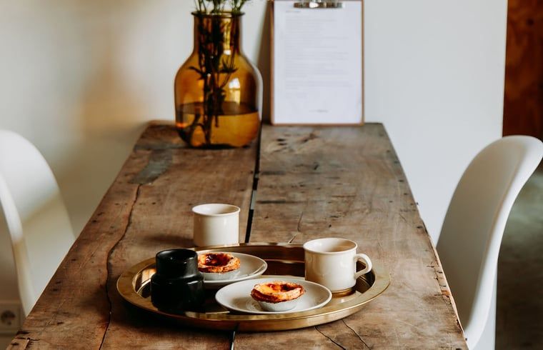 Dining table with coffee at Holiday home in Chaam, North Brabant, cozy setting for breakfast or lunch.