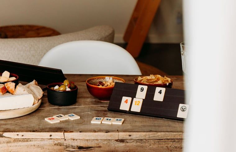 Game night at Holiday Home in Chaam, North Brabant, with snacks and games in a cozy setting.