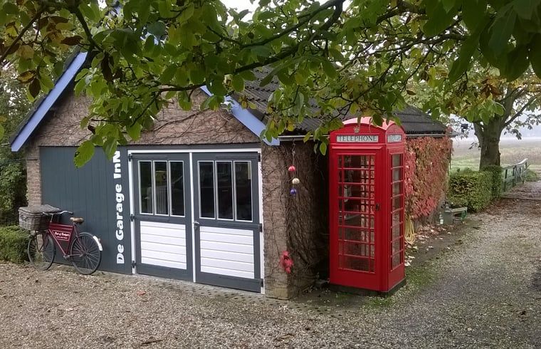 Exterior of Cottage in Hank, vacation home in Heart of Brabant, North Brabant, with English telephone box.