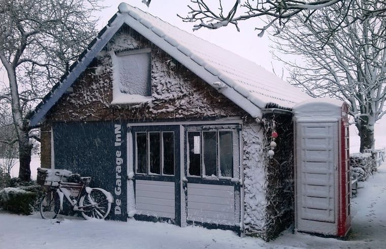 Winter landscape at Cottage in Hank, vacation home in Heart of Brabant, North Brabant, covered in snow.