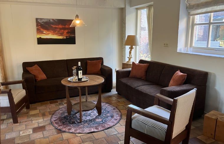 Gemuetliches Wohnzimmer im Ferienhaus in Boxtel, Herz von Brabant. Geniessen Sie Komfort und Atmosphaere in diesem Ferienhaus in Nordbrabant.