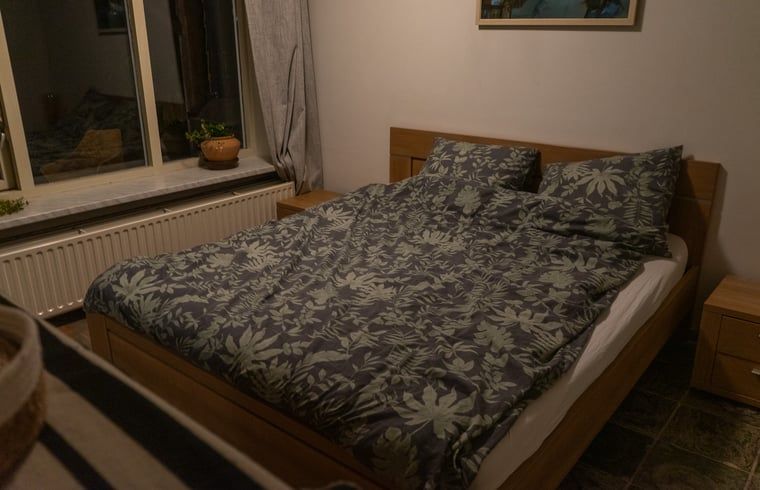Cozy bedroom in Holiday home in Best, located in the heart of Brabant, North Brabant, with comfortable double bed and attractive decor.