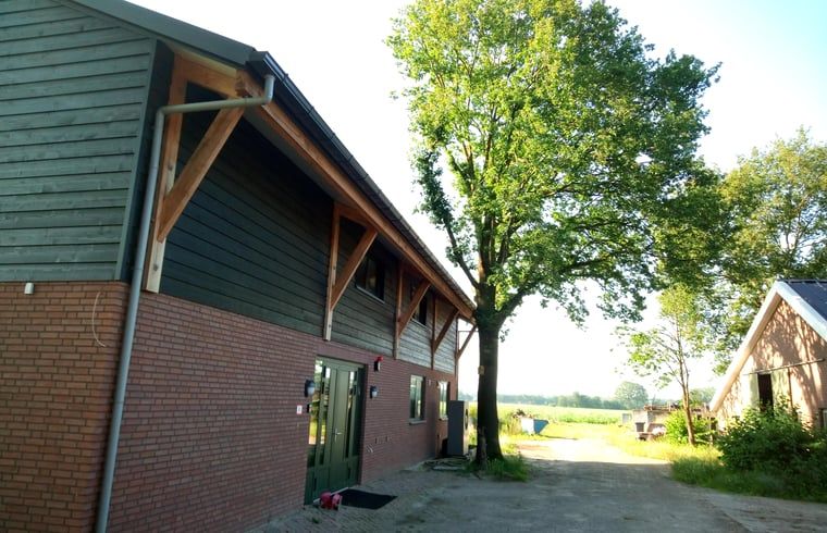 Vakantiehuis in Erp, Noord Brabant, buitenaanzicht met groene omgeving.