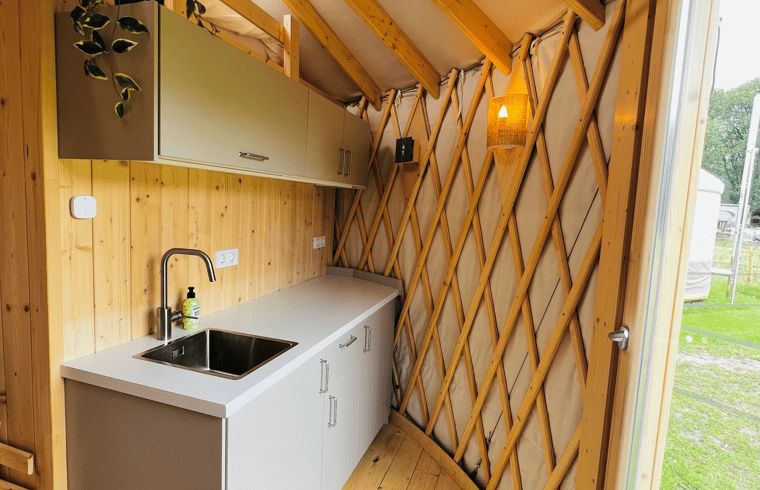 Spacious living space in Holiday Home in Ledeacker with wooden interior and seating area.