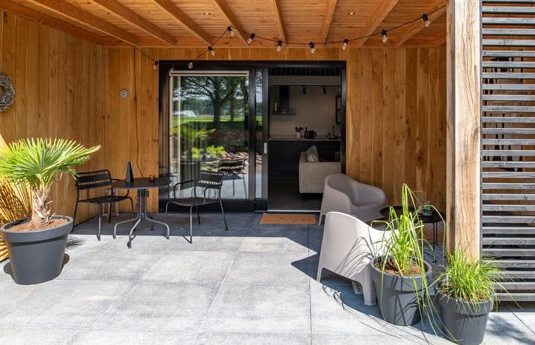 Cozy porch at Holiday Home in Sint Agatha, northeast Brabant, perfect for relaxation.
