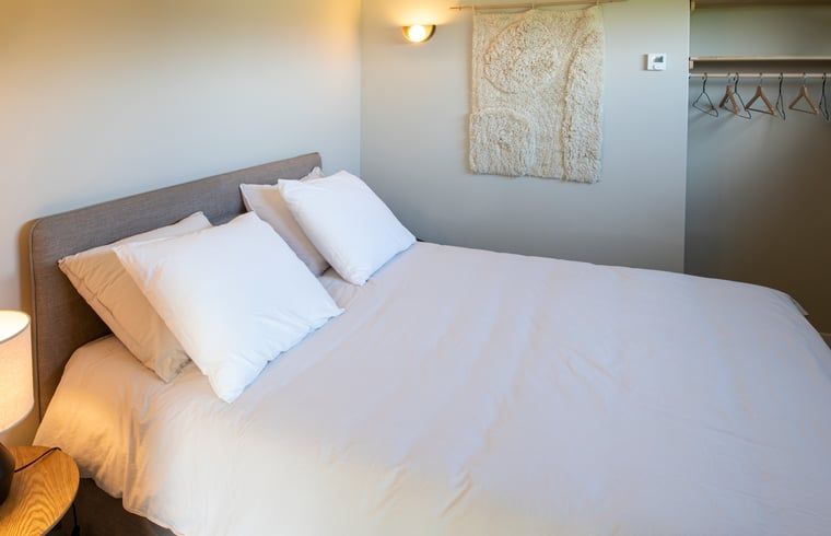 Comfortable bedroom in Holiday home in Sint Agatha, Northeast Brabant with luxury bedding.