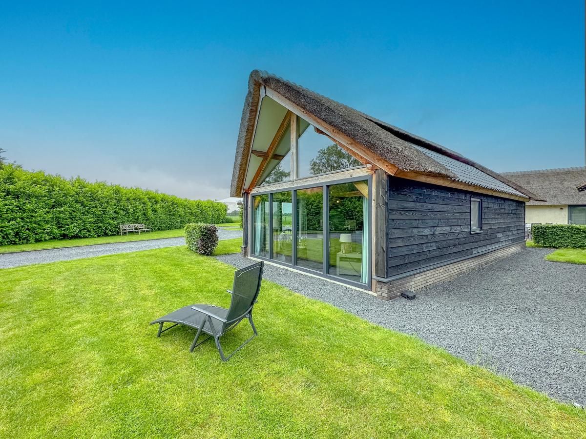 Rear view of Villa Bianco in Alphen, West Brabant with green surroundings.