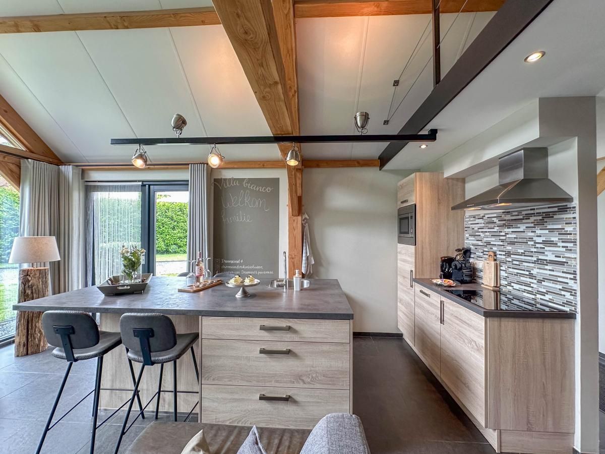 Stylish kitchen in Villa Bianco vacation home, Alphen, North Brabant.