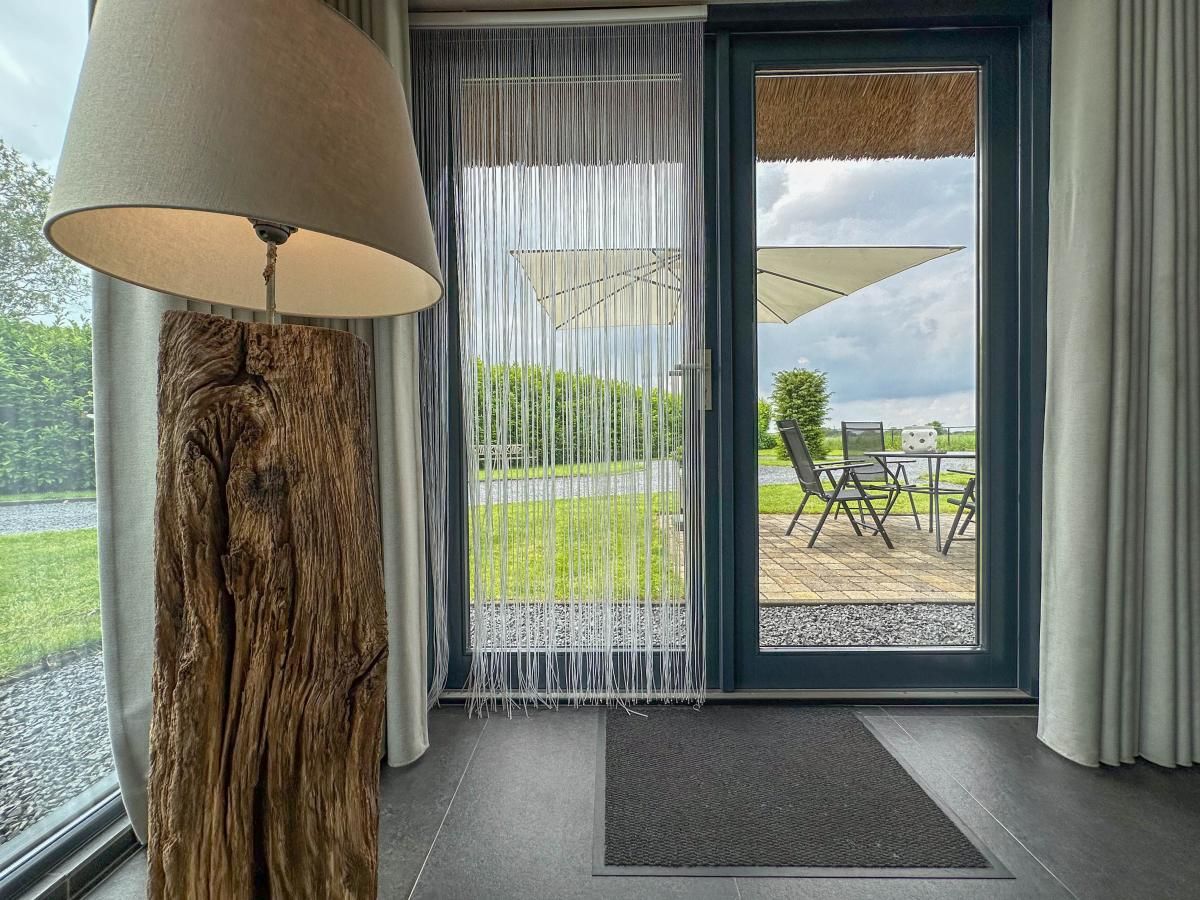 View of the terrace from the living room of Villa Bianco, Alphen.