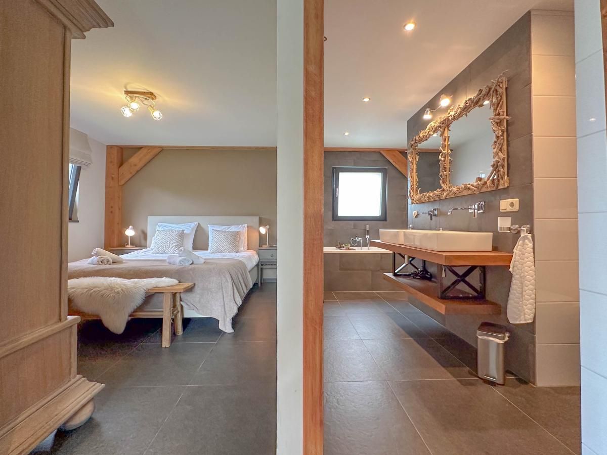 Modern bathroom with double sink in Villa Bianco, Alphen.