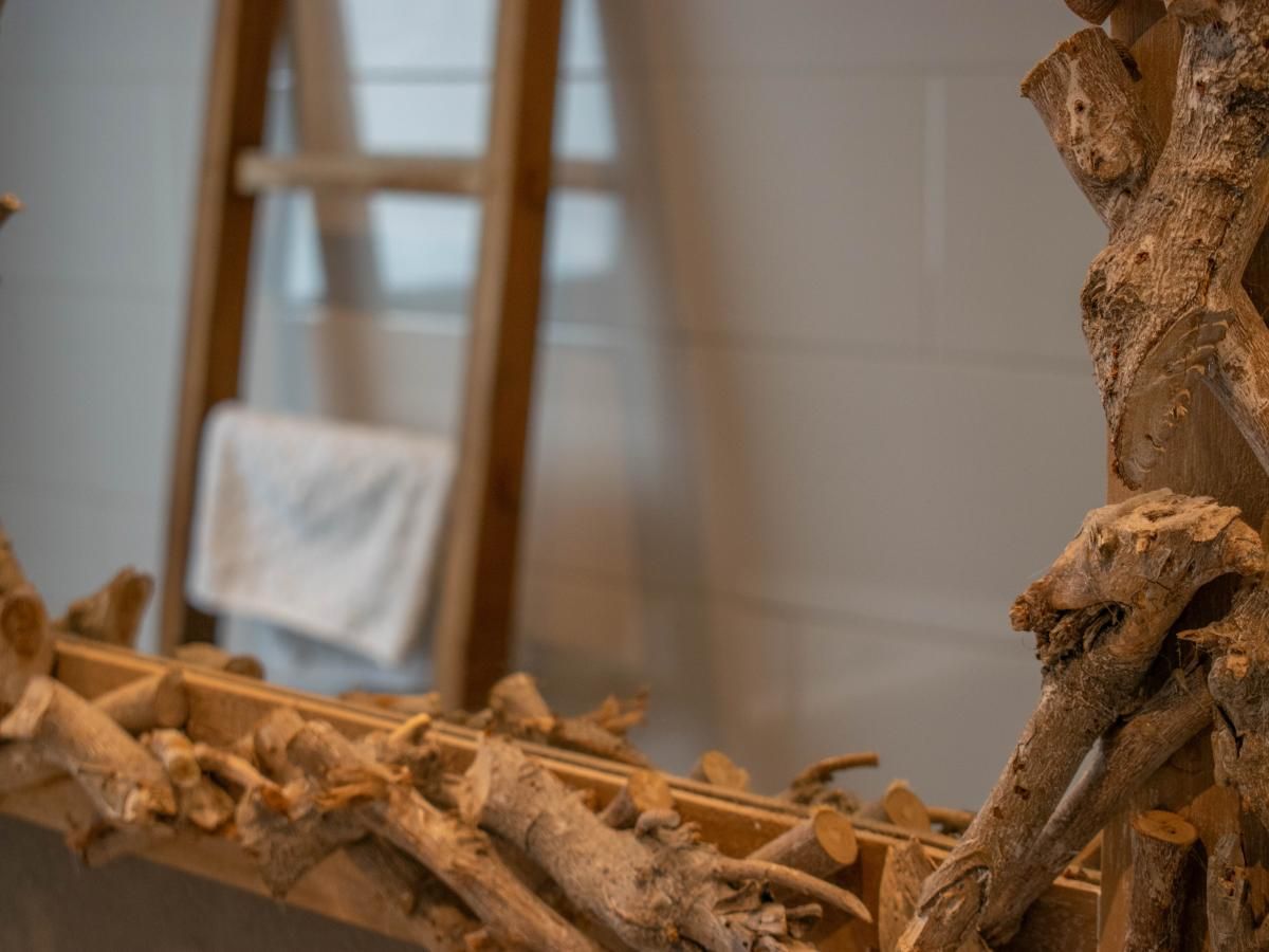 Detail of the rustic mirror in the bathroom of Villa Bianco, Alphen.