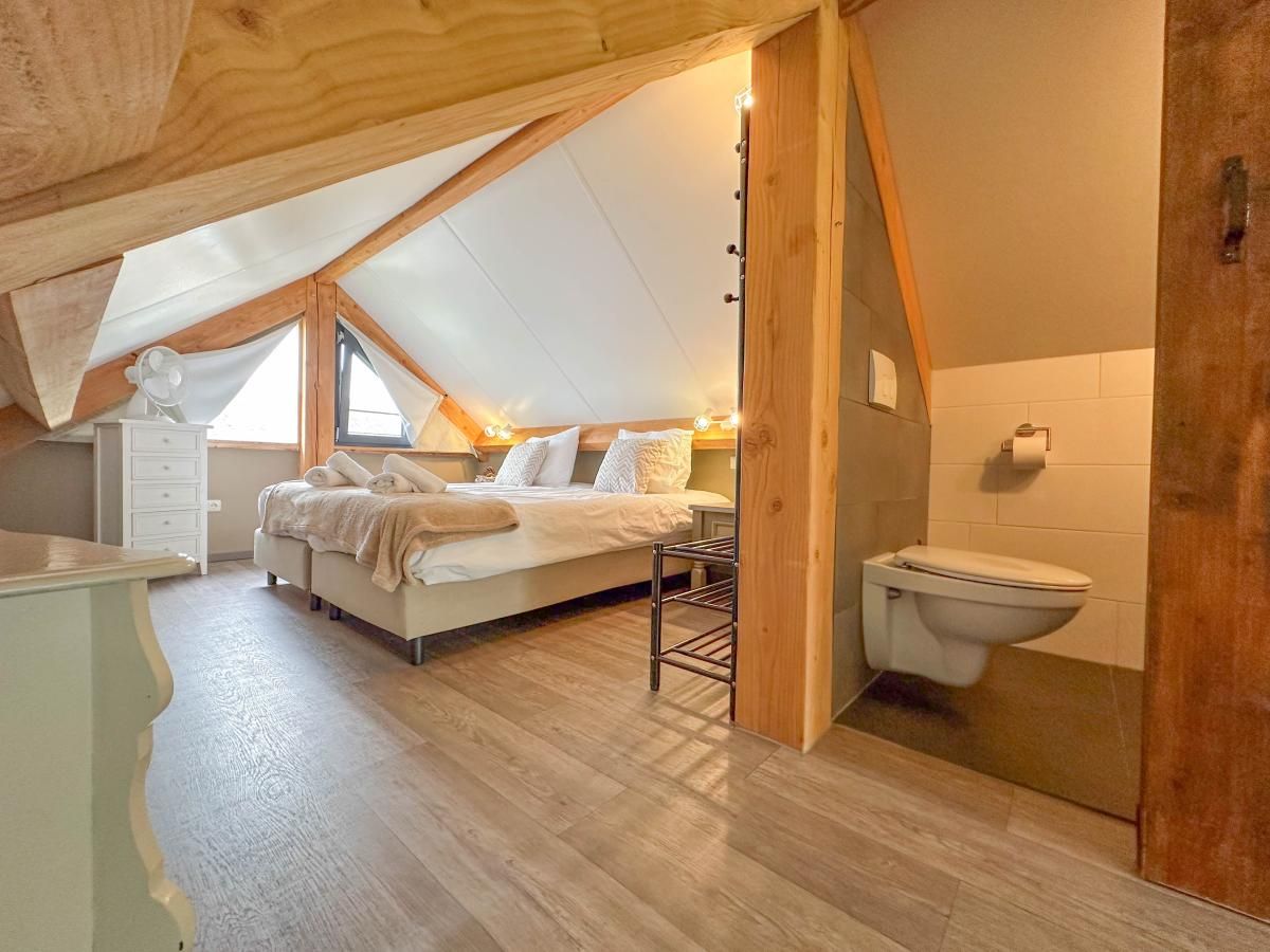 Attic room with ensuite toilet in Villa Bianco vacation home, North Brabant.