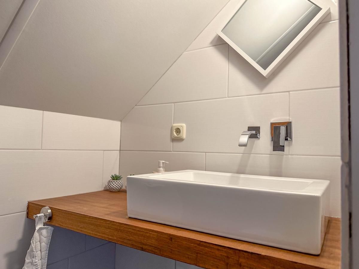 Compact sink in the attic of Villa Bianco, Alphen, West Brabant.