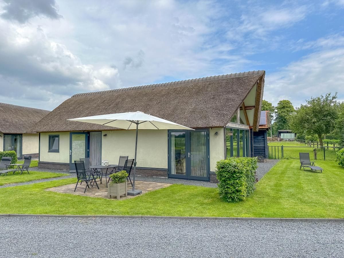 Exterior of Villa Bianco vacation home with terrace in Alphen, North Brabant.