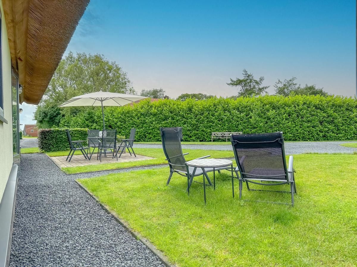 Spacious terrace with seating at Villa Bianco in Alphen, West Brabant.