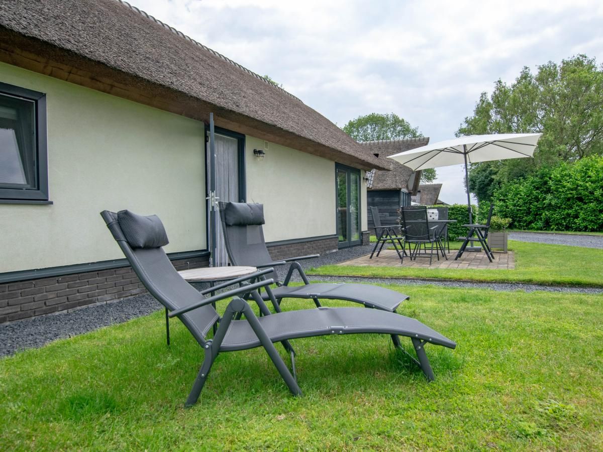 Comfortable lounge chairs on the lawn of Villa Bianco, Alphen.
