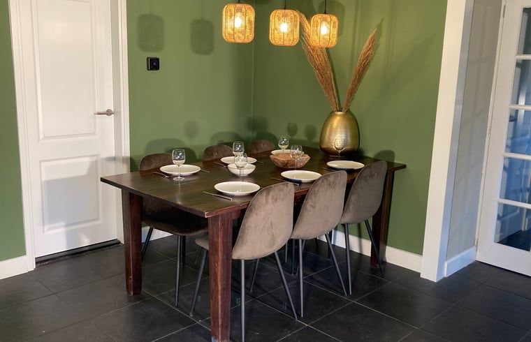 Dining table in cottage in Oosterhout, vacation home in Oosterhout, West Brabant, North Brabant.