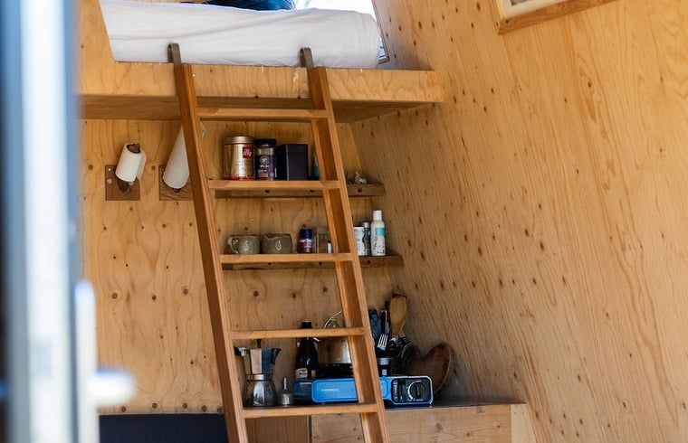 Sleeping loft and kitchen in Holiday cottage in Werkendam, West Brabant, North Brabant.